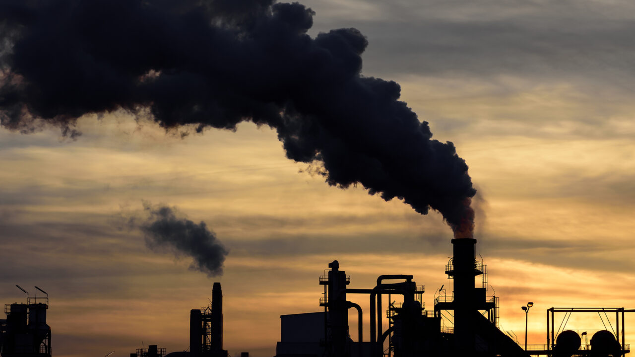 a cloud of pollution released by an industry.