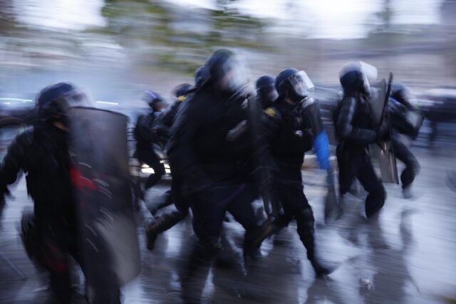 France raised the number of people detained in Paris during Saturday’s protests to 142.